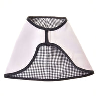 The reversible Hobby Horse blanket laid flat with the light side out, showing the black and white houndstooth lining