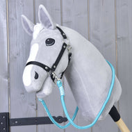 Light grey Hobby Horse in a black halter wearing the turquoise Reins Atlantis looped around its neck