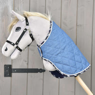 Grey Hobby Horse in a black halter wearing the quilted Blanket Beautiful Jeans with tartan trim over its neck