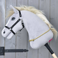 Grey Hobby Horse in a black halter with the sand-coloured Cordeo Nature knotted around the base of its neck