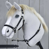 Light grey Hobby Horse in a black halter wearing the Martingale black around its neck, two silver rings in front