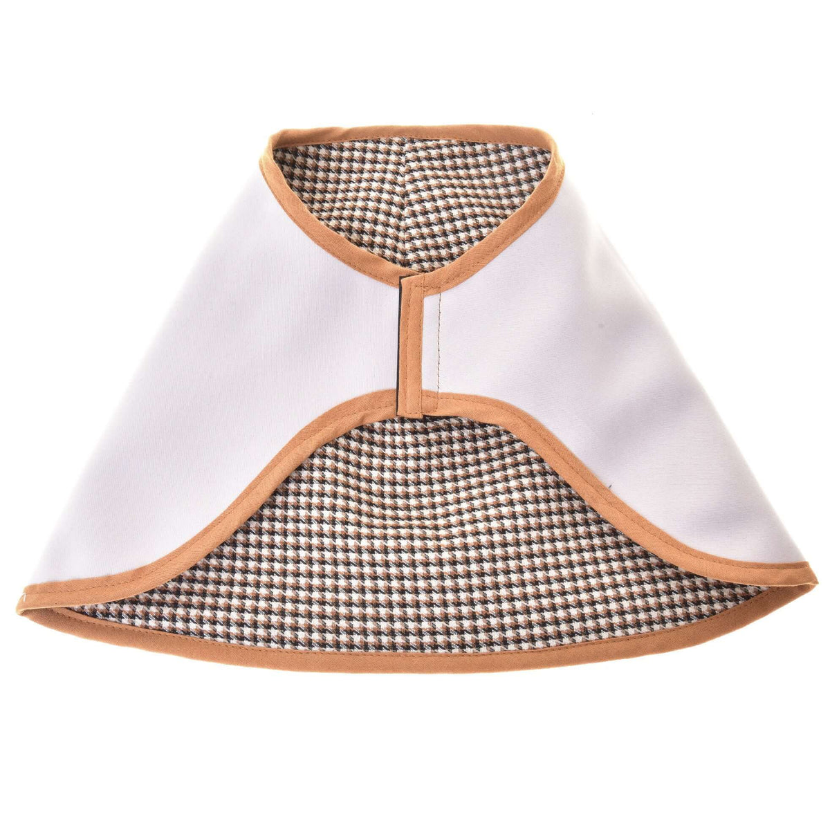 The reversible Hobby Horse blanket laid flat with the light side out, showing the brown houndstooth lining and caramel edging