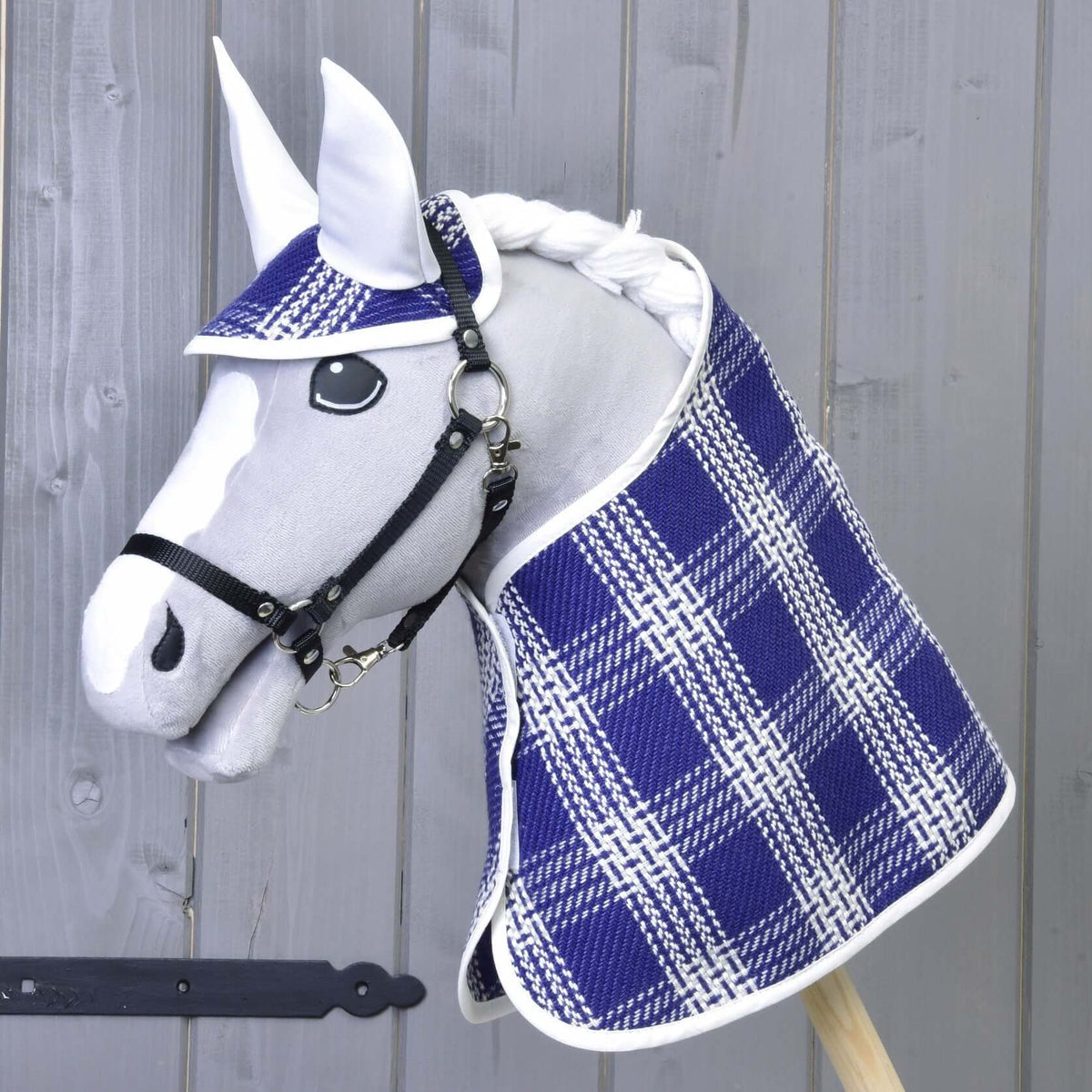 Grey Hobby Horse in a black halter wearing the blue and white checked Set Blue Cube, front three-quarter view