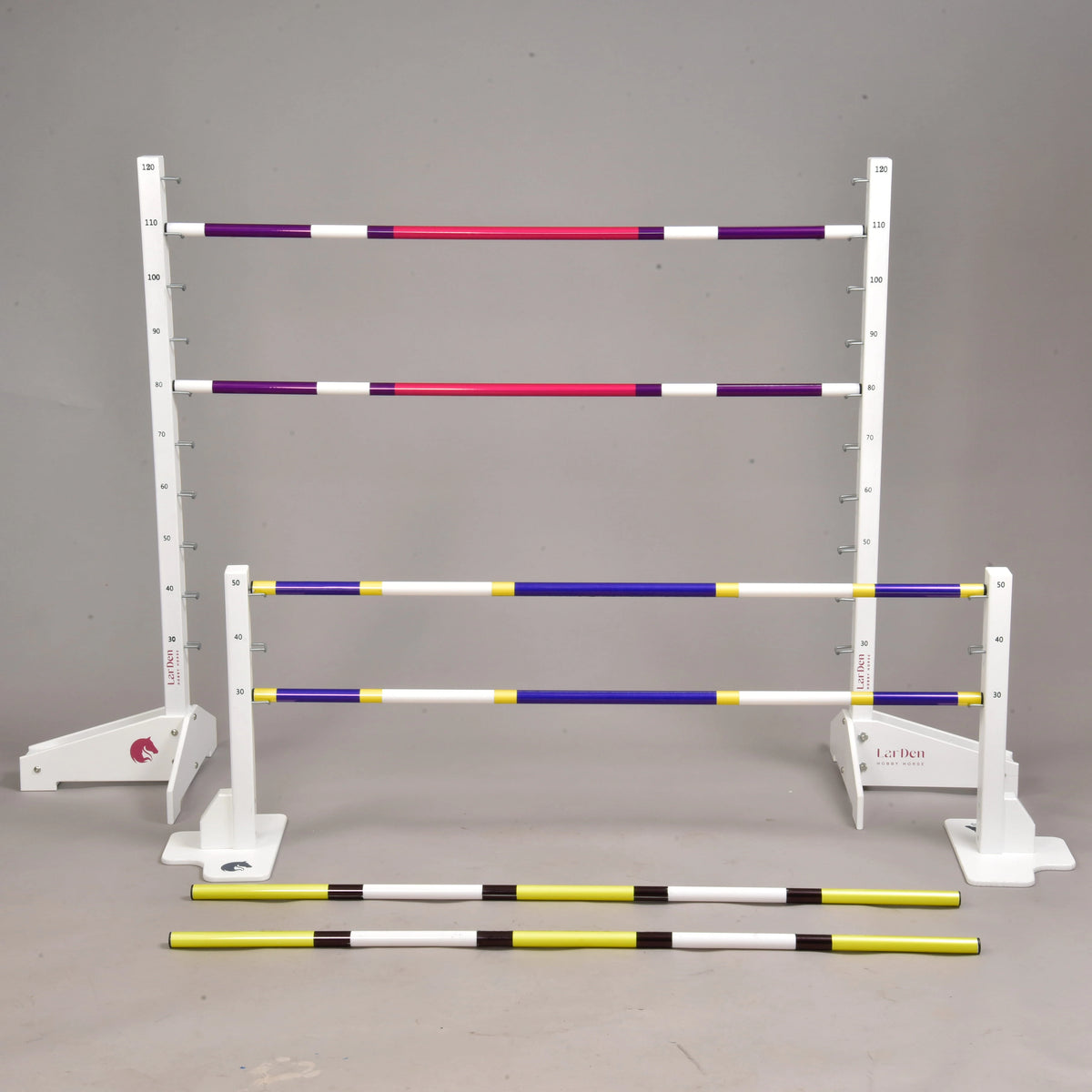LarDen Jump set for Hobby Horsing: tall and low white stands with purple-pink, blue-yellow and yellow-black poles