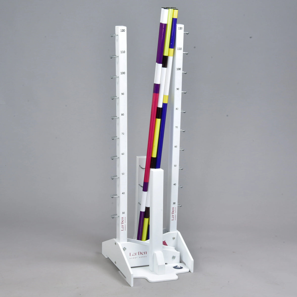 Whole jump set stored upright: tall and low stands stacked together with all the striped poles standing in the middle