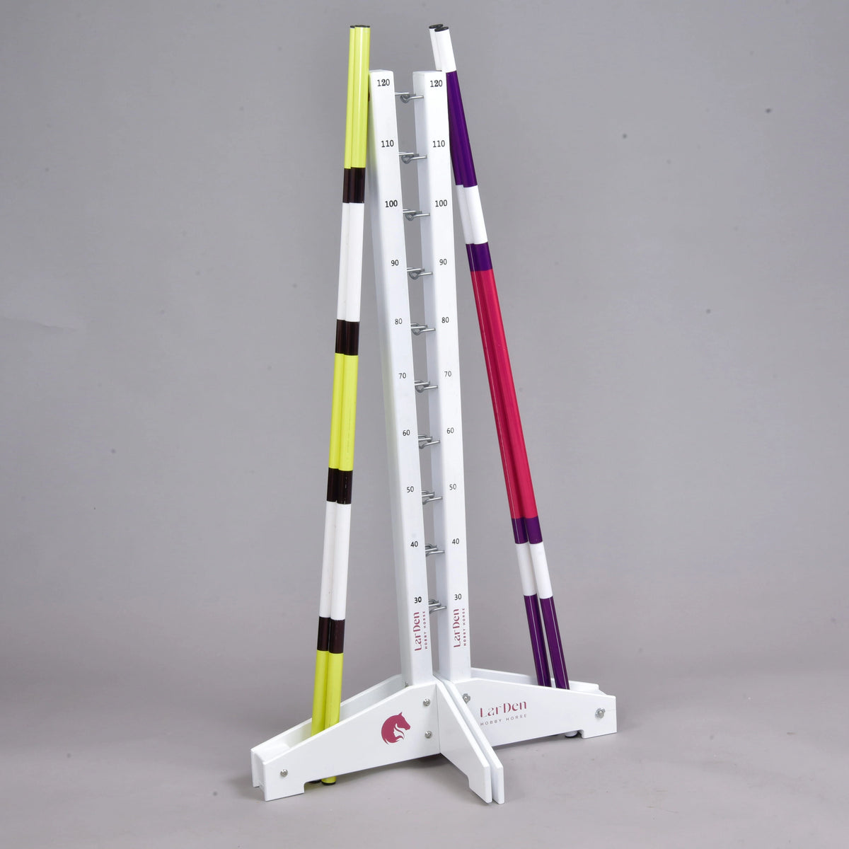 The two tall stands back to back with a yellow-black pole leaning on one side and a purple-pink pole on the other