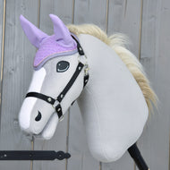 Light grey Hobby Horse with a black halter and cream mane wearing the lilac crocheted ear bonnet