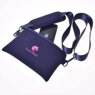 Hobby Horse Cross body bag from another angle, a smartphone in the top zip and a padded shoulder pad on the strap