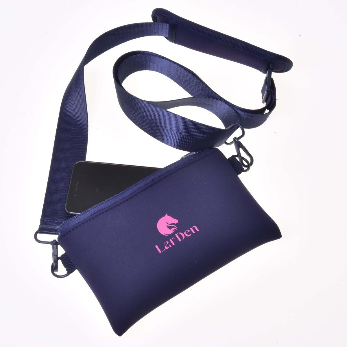 Hobby Horse Cross body bag by LarDen in navy neoprene with a pink horse head logo, wide strap and a phone peeking out