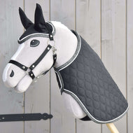 Light grey Hobby Horse in a black halter wearing the Set Thermo Black Queen, black quilting with sparkly silver edging