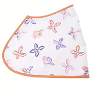 Side view of the Hobby Horse butterfly blanket laid flat: white softshell with orange and purple butterflies and a rust edge