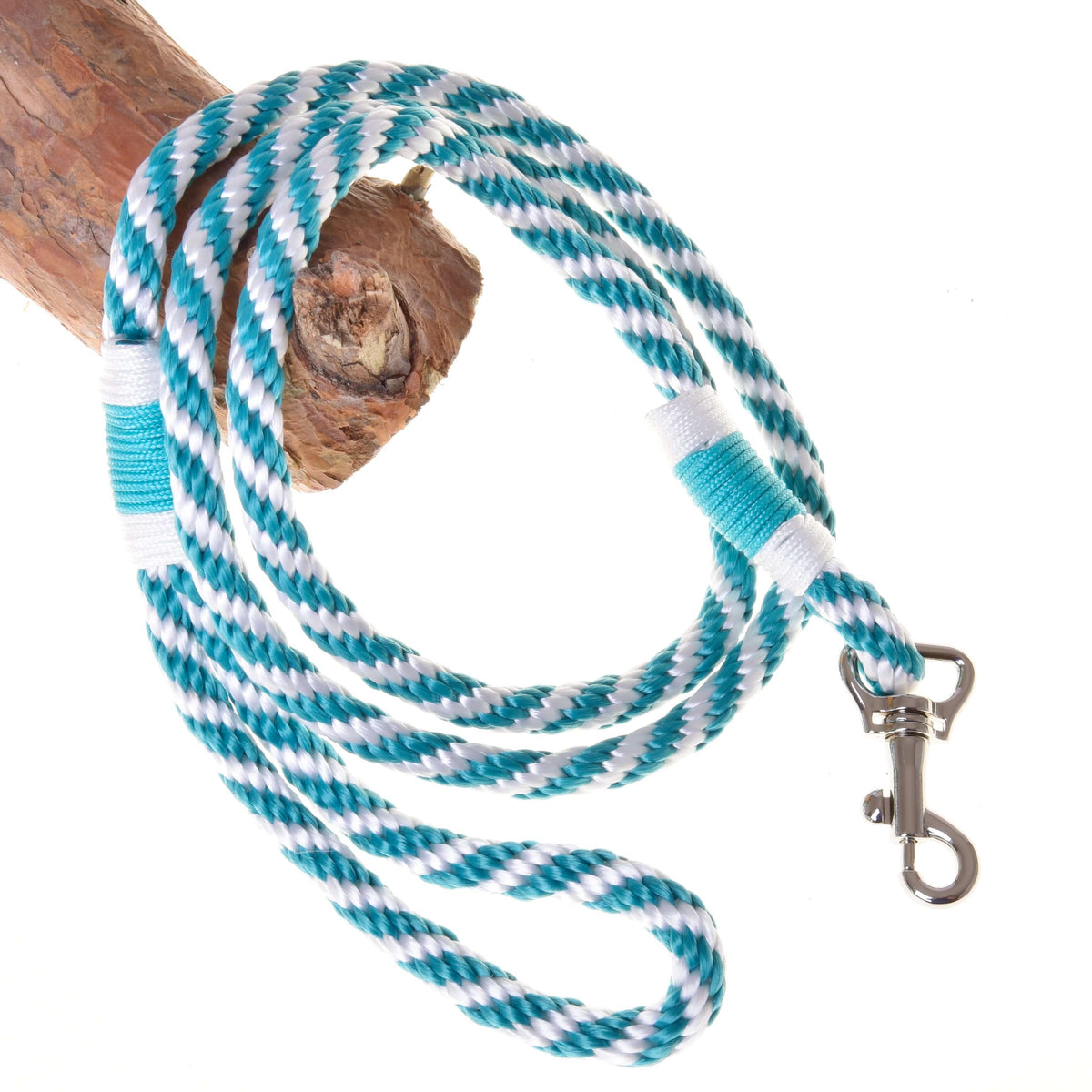 Turquoise and white twisted Hobby Horse lead rope with a hand loop and silver snap hook over a branch