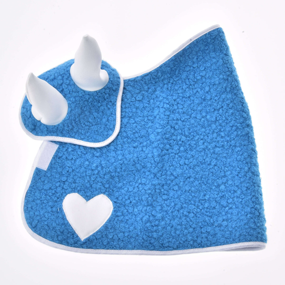 The Set Mystery laid flat on white from the heart side: blue curly blanket with a white heart and ear bonnet with white ears
