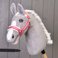 A grey plush Hobby Horse with a white blaze and braided mane wears the red striped halter with white fur