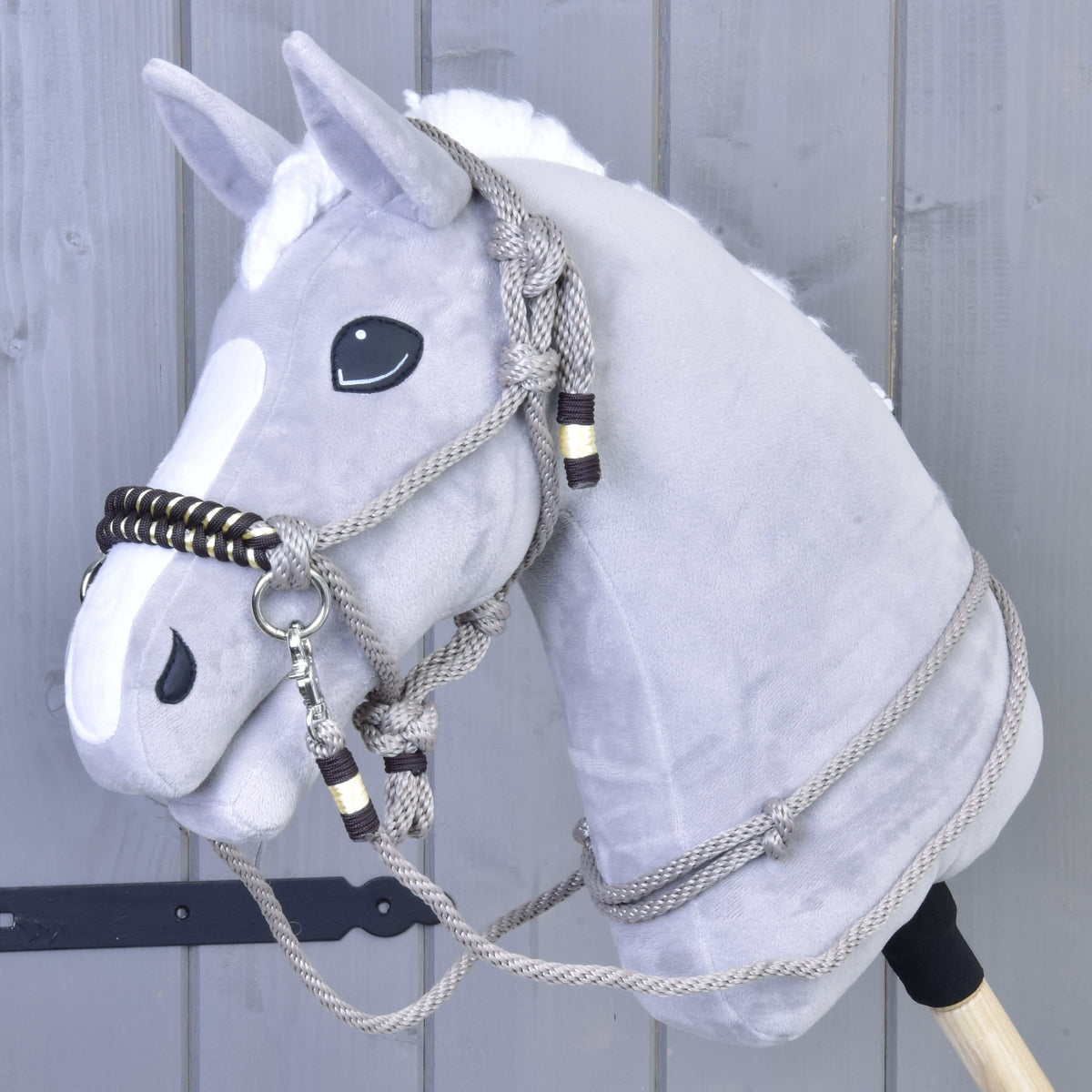 Grey plush Hobby Horse wearing Rope set Splendid: taupe rope halter and reins with a dark brown and gold braided noseband