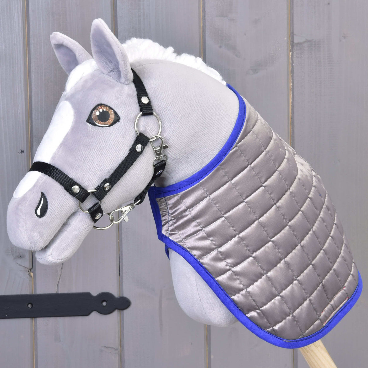 Grey Hobby Horse in the Blanket DeLuxe Blue worn reversed, silver-grey quilting outside with royal blue edging