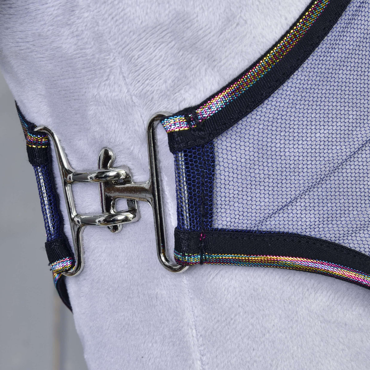 Close-up of the silver metal clip joining the two front edges of the mesh fly sheet, both trimmed with rainbow piping