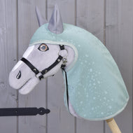 Grey Hobby Horse in a black halter wearing the mint green raincoat with droplet print and grey ear covers