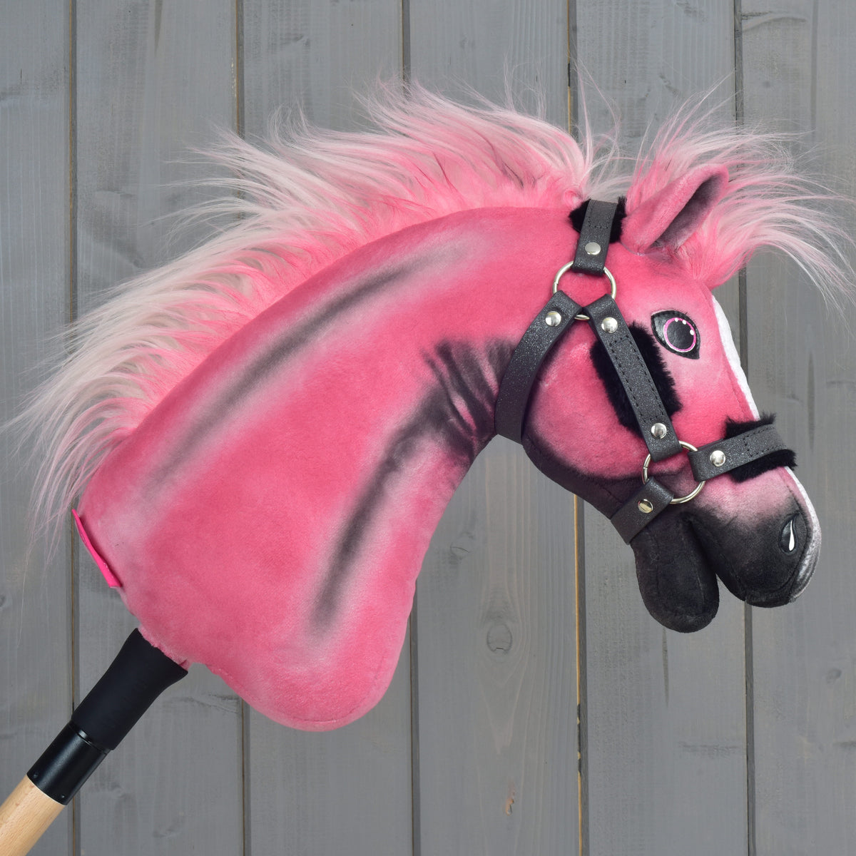 Hobby Horse Pinkie facing right, dark grey glittery halter lined with black fur and a long pink mane flowing back