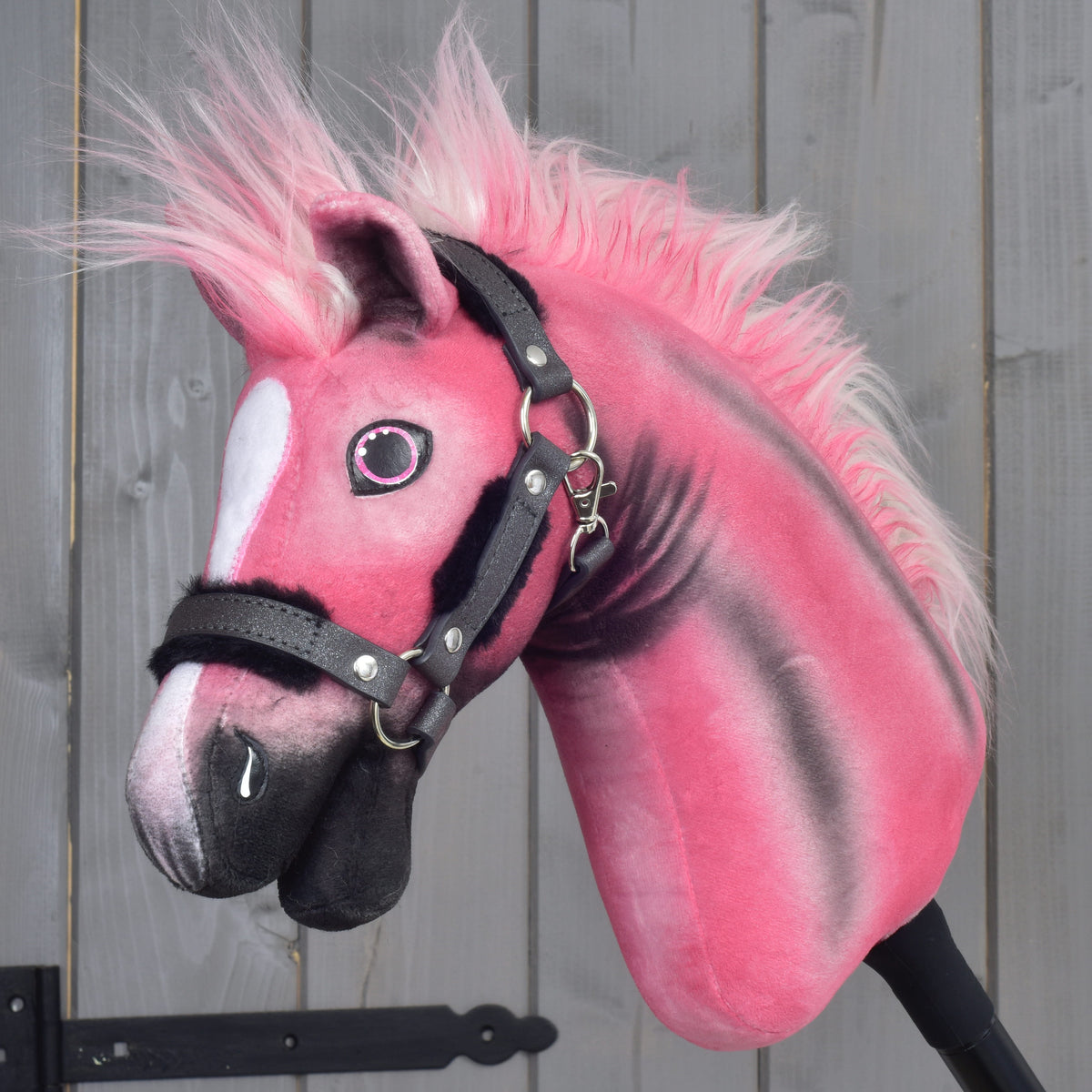 Hobby Horse LarDen Pinkie with a glittery halter: pink plush head with black shading, white blaze and pink and white mane
