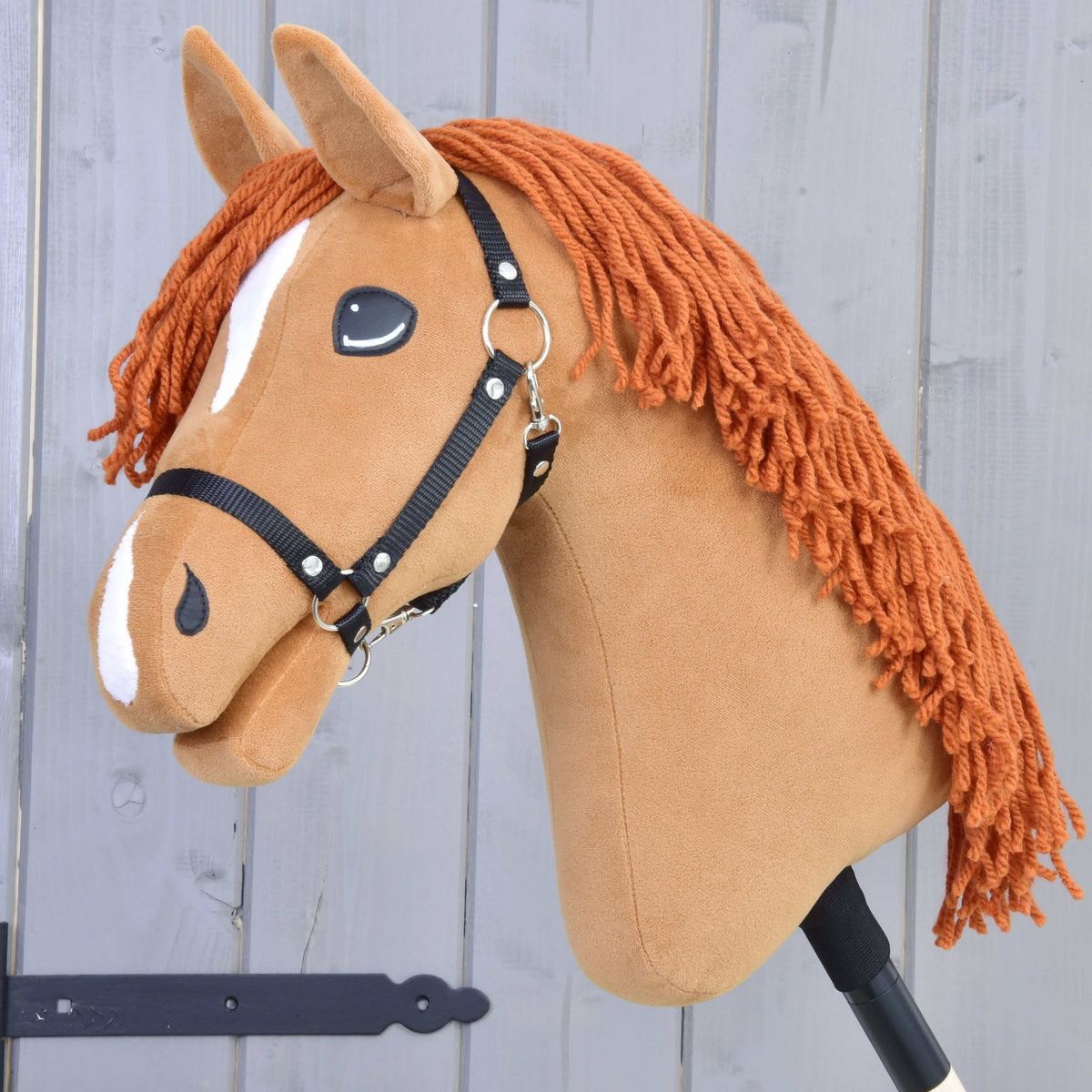Hobby Horse Little Angel with Black Halter by LarDen, a chestnut plush head with a copper yarn mane and white markings