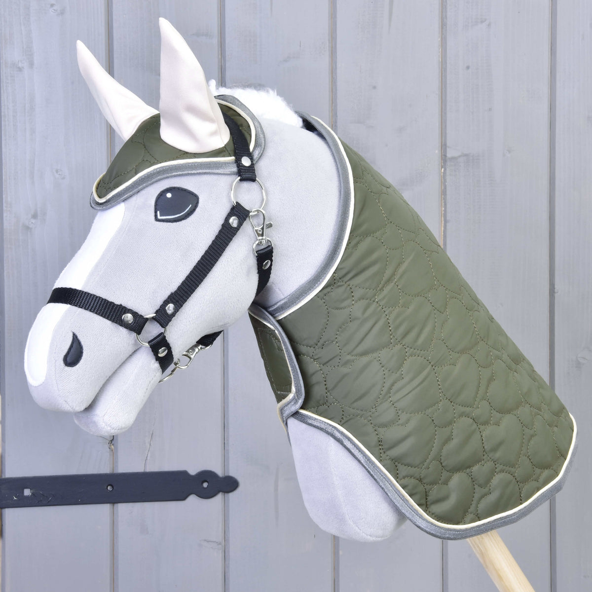 Set Olivetti on a grey plush Hobby Horse: olive quilted blanket and ear bonnet with cream ears, black halter