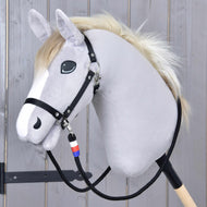 Reins Emblem CZ on a grey Hobby Horse with a cream mane and black halter, the white, red and blue wrap below the chin