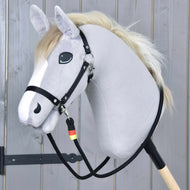 Grey Hobby Horse in a black halter with Reins Emblem clipped on, the black rope reins hanging down to the stick