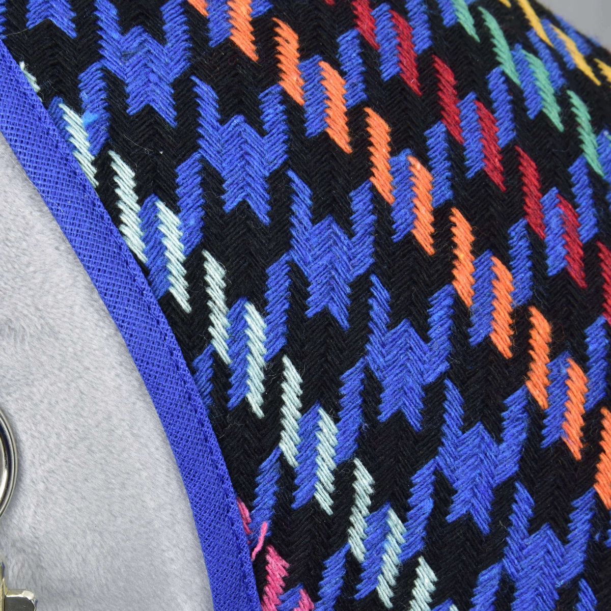 Close-up of the Hobby Horse Stable Blanket Peru: woven blue and black houndstooth with orange and mint stripes