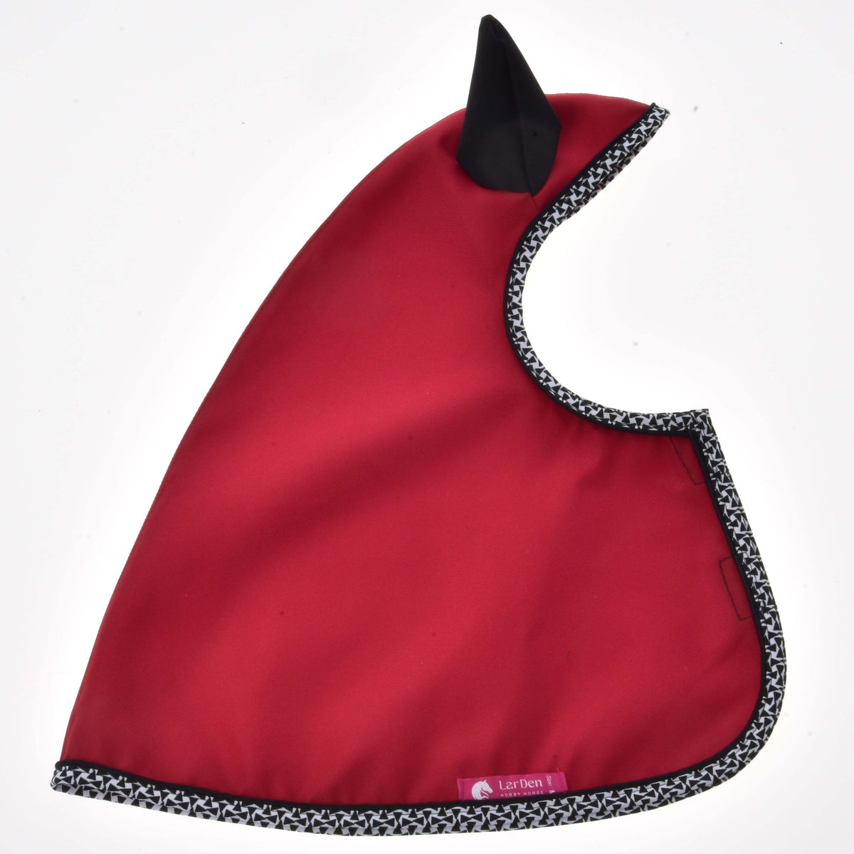 Hobby Horse Raincoat Red Ferrari laid flat, red fabric with one black ear, geometric black and white trim and a pink label