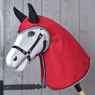Grey Hobby Horse in a black halter wearing the Raincoat Red Ferrari, its red hood and neck framed by black and white binding