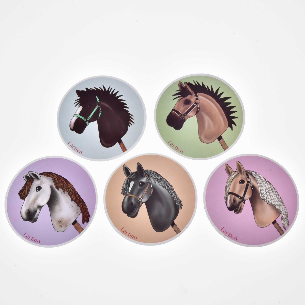 Set Stickers New by LarDen: five round stickers with drawn Hobby Horse heads on pastel blue, green, lilac, peach, pink