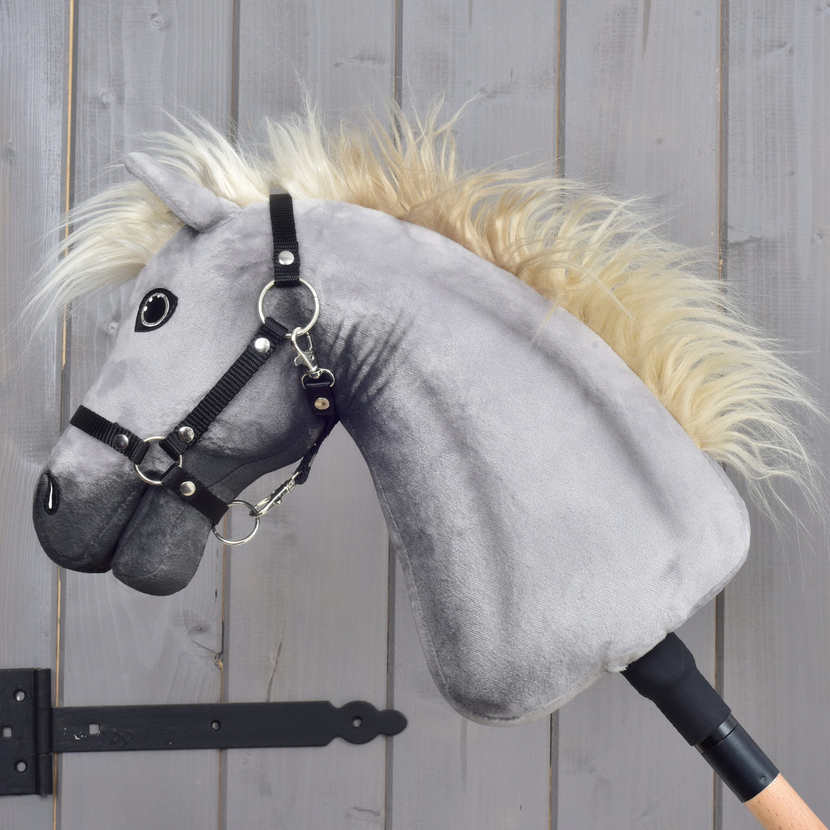 Silver Dream Hobby Horse in left profile showing long cream mane, sparkling eye and black halter with silver rings
