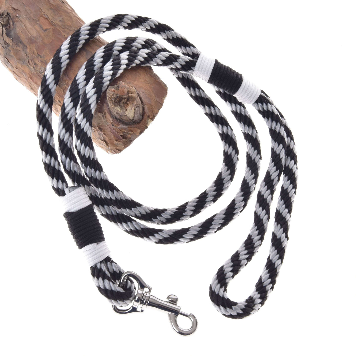 LarDen Hobby Horse Lead rope stripe black, a black and silver twisted lead with white whipping and snap hook on a branch
