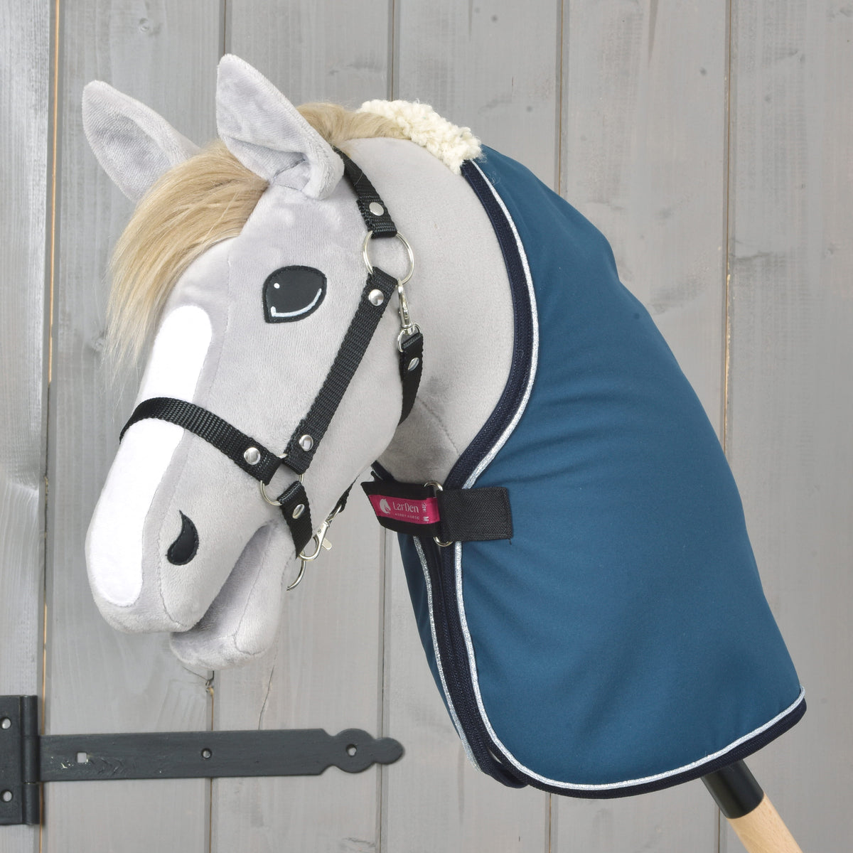 Grey Hobby Horse with a blond mane and black halter wearing the petrol blue Stable Blanket Winter Sky with silver piping