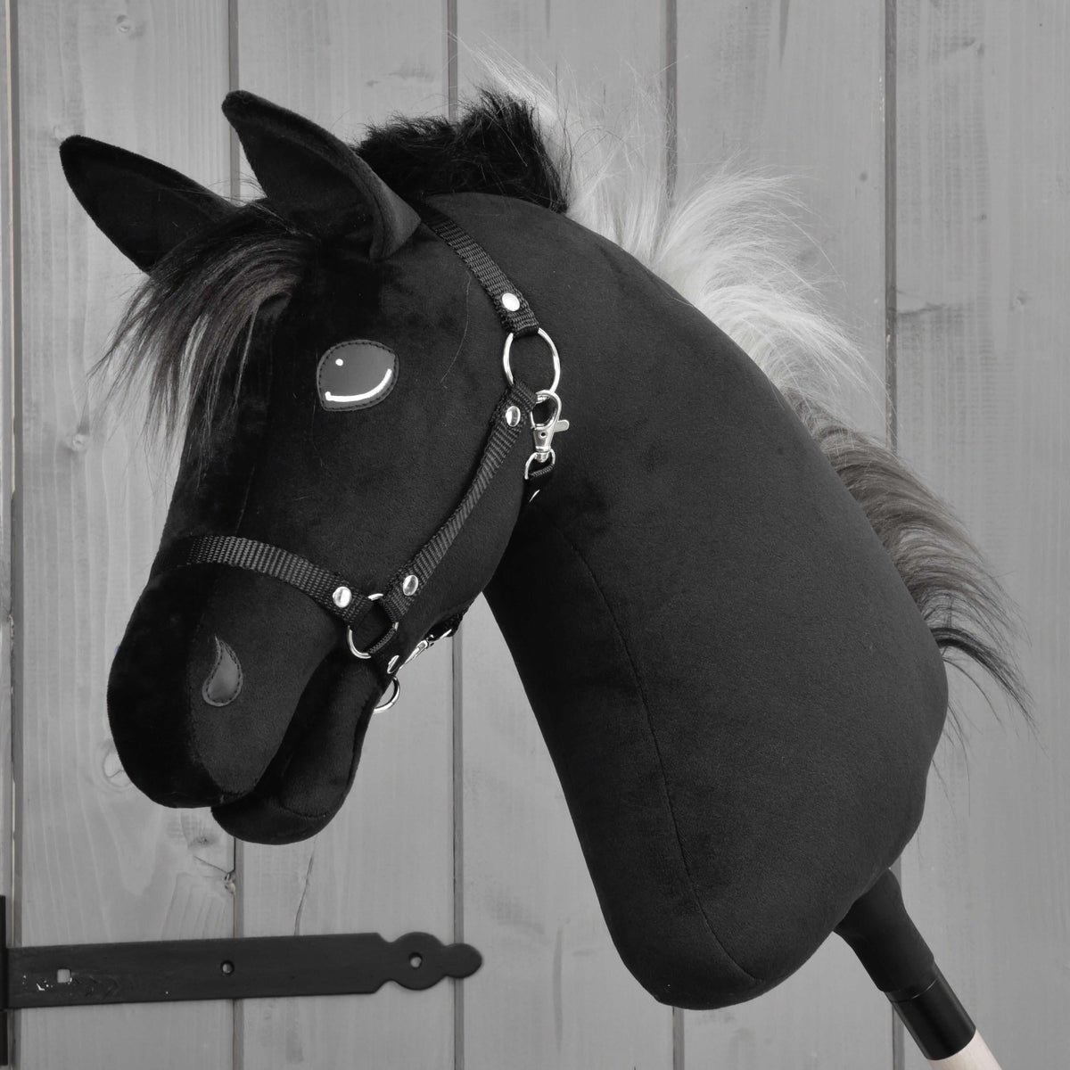 Hobby Horse Bond with Black Halter by LarDen, a black plush head with a fluffy black and silver-grey mane, side view