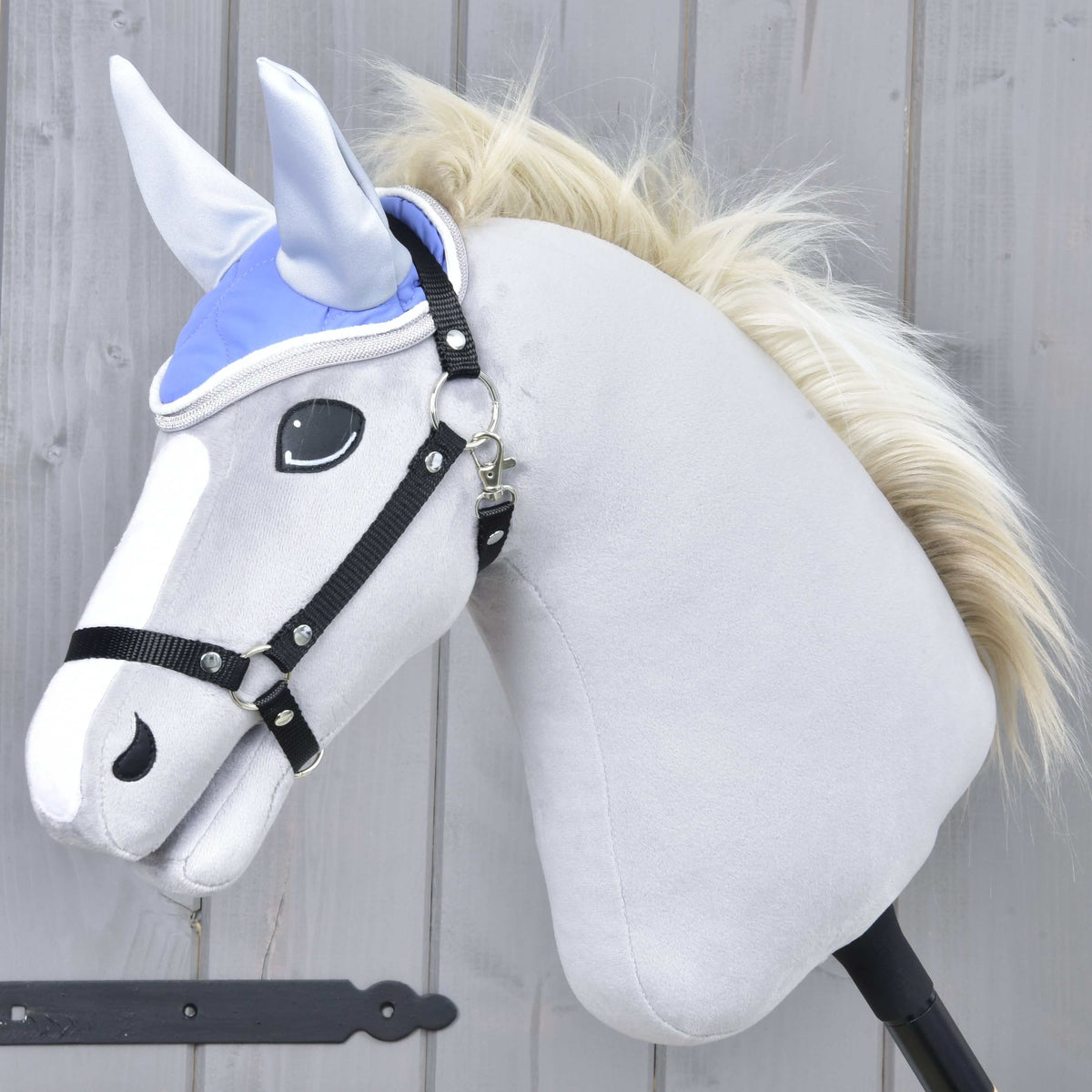 Grey Hobby Horse with a blond mane and black halter wearing the Ear Bonnet Light Violett with light grey ears