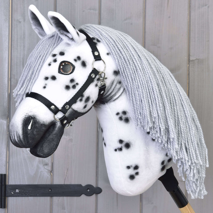 Hobby Horse Chantal with Black Halter by LarDen, a white plush head with black spots and a long grey yarn mane