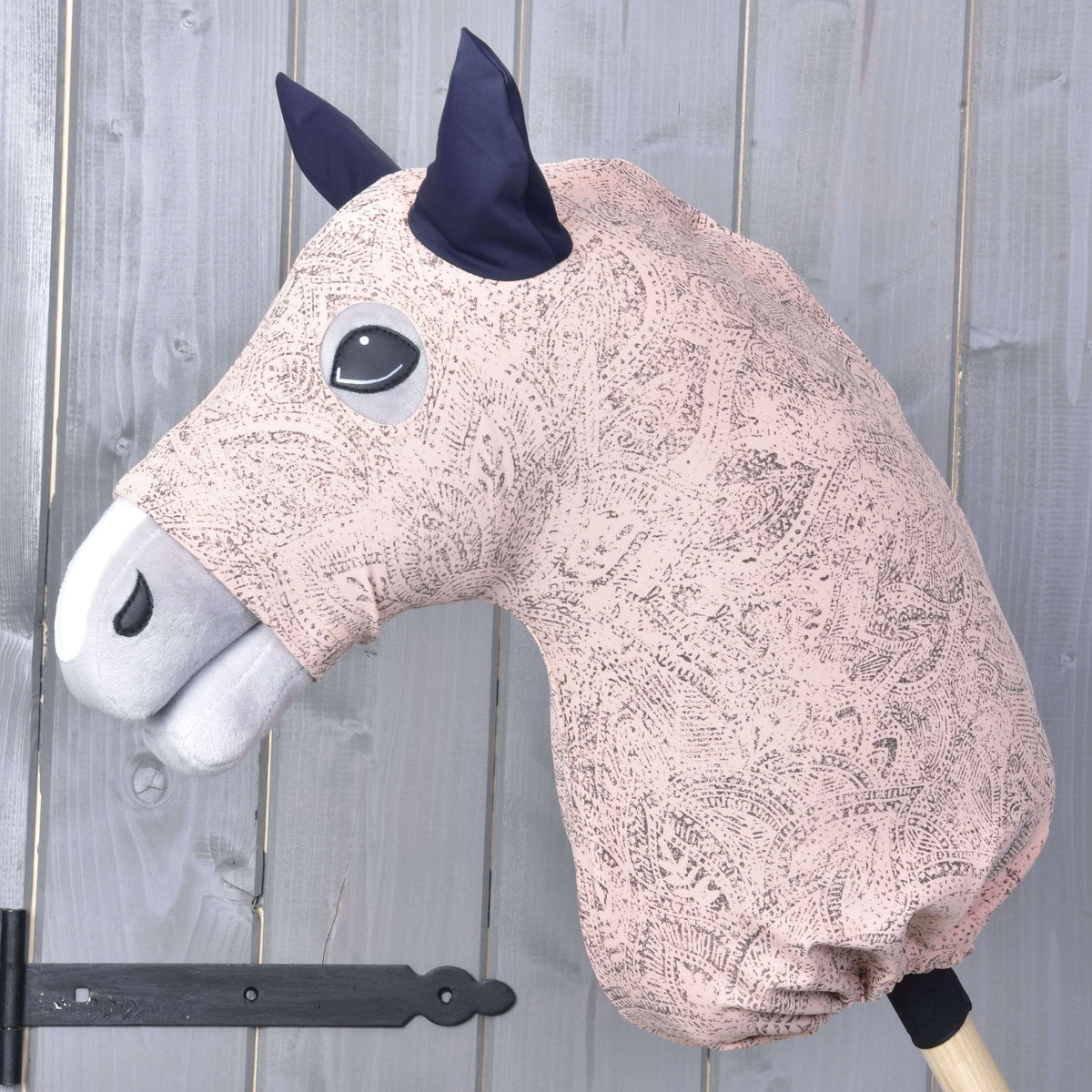 Hobby Horse protective suit Cosmos (Lycra) by LarDen on a grey head, pale pink with a grey paisley print and navy ears