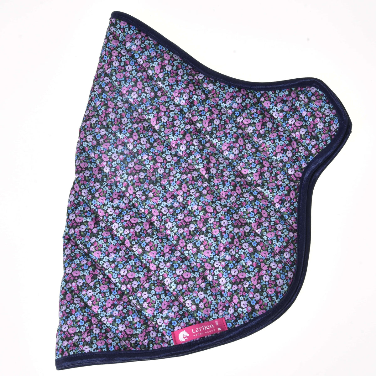 Quilted flower blanket laid flat from the side, small pink, lilac and blue flowers, navy binding and a pink LarDen label
