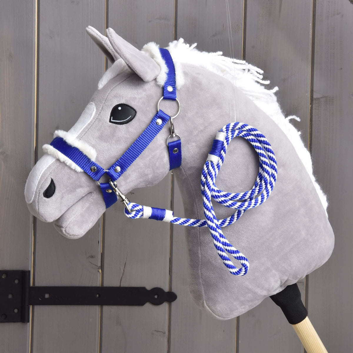 Grey Hobby Horse in the royal blue fur-lined halter of the Set Essential Blue with the blue and white lead rope clipped on
