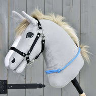 Light grey Hobby Horse with a cream mane and black halter wearing the Cordeo Sky, a blue knotted rope low on its neck