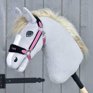 Light grey Hobby Horse with a cream mane wearing the Fur Halter LarDen Pink, a black fur noseband and pink straps