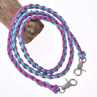 Hobby Horse Reins knitted pinkie blue by LarDen, braided magenta and light blue cord with two snap hooks, on a branch