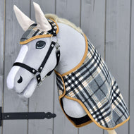 Light grey Hobby Horse in a black halter wearing the Set England Grey, a grey check blanket and ear bonnet with cream ears