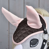 Ear Bonnet Chocolate on a grey Hobby Horse in close-up, the light pink ears standing over the quilted brown satin
