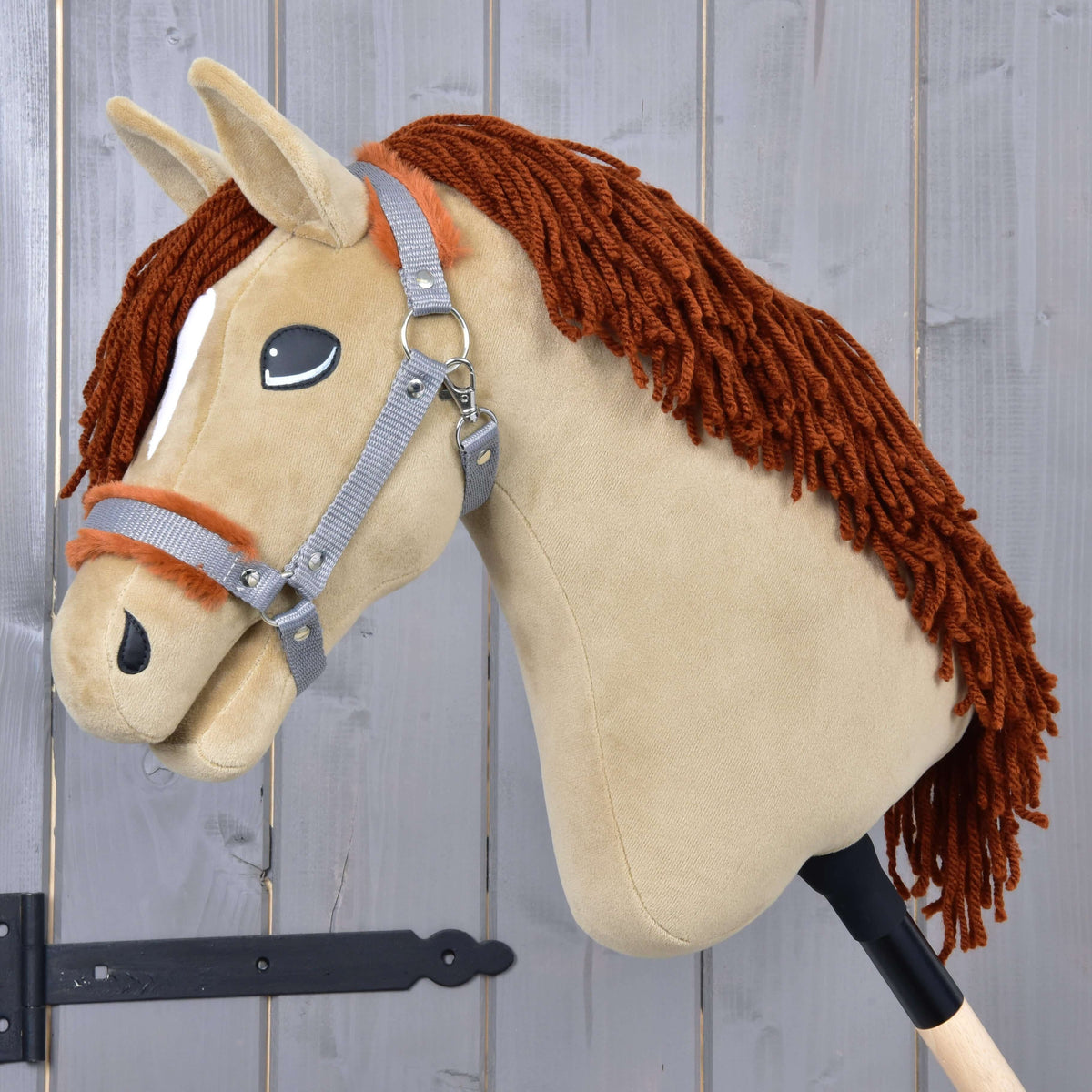 Fur Halter for FREE with Hobby Horse Oliver: grey webbing halter with brown fur, shown on a sand-coloured plush head