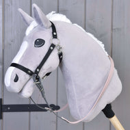 Grey plush Hobby Horse with a black halter and the rubberized dark grey and pale pink reins buckled to its rings