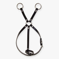 Hobby Horse Martingale brown by LarDen laid flat, a very dark leatherette neck strap with buckles and three silver rings