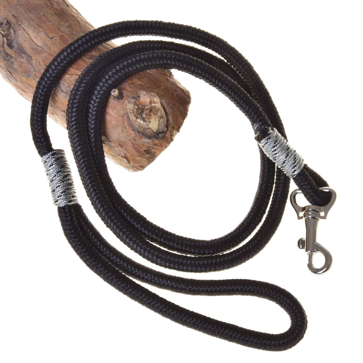 LarDen Hobby Horse Lead Rope Black, braided lead with grey whipped accents and a silver snap hook, draped over a wooden branch